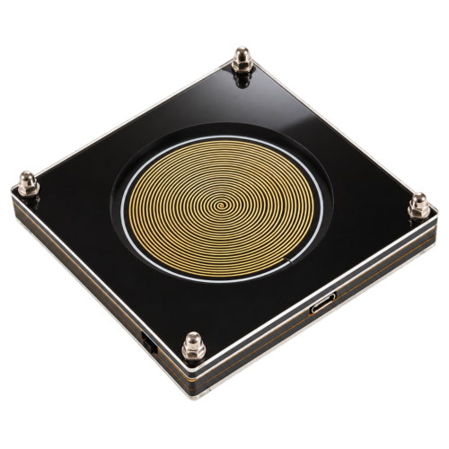 Gold spiral Schumann device with black acrylic case, isolated on a transparent background